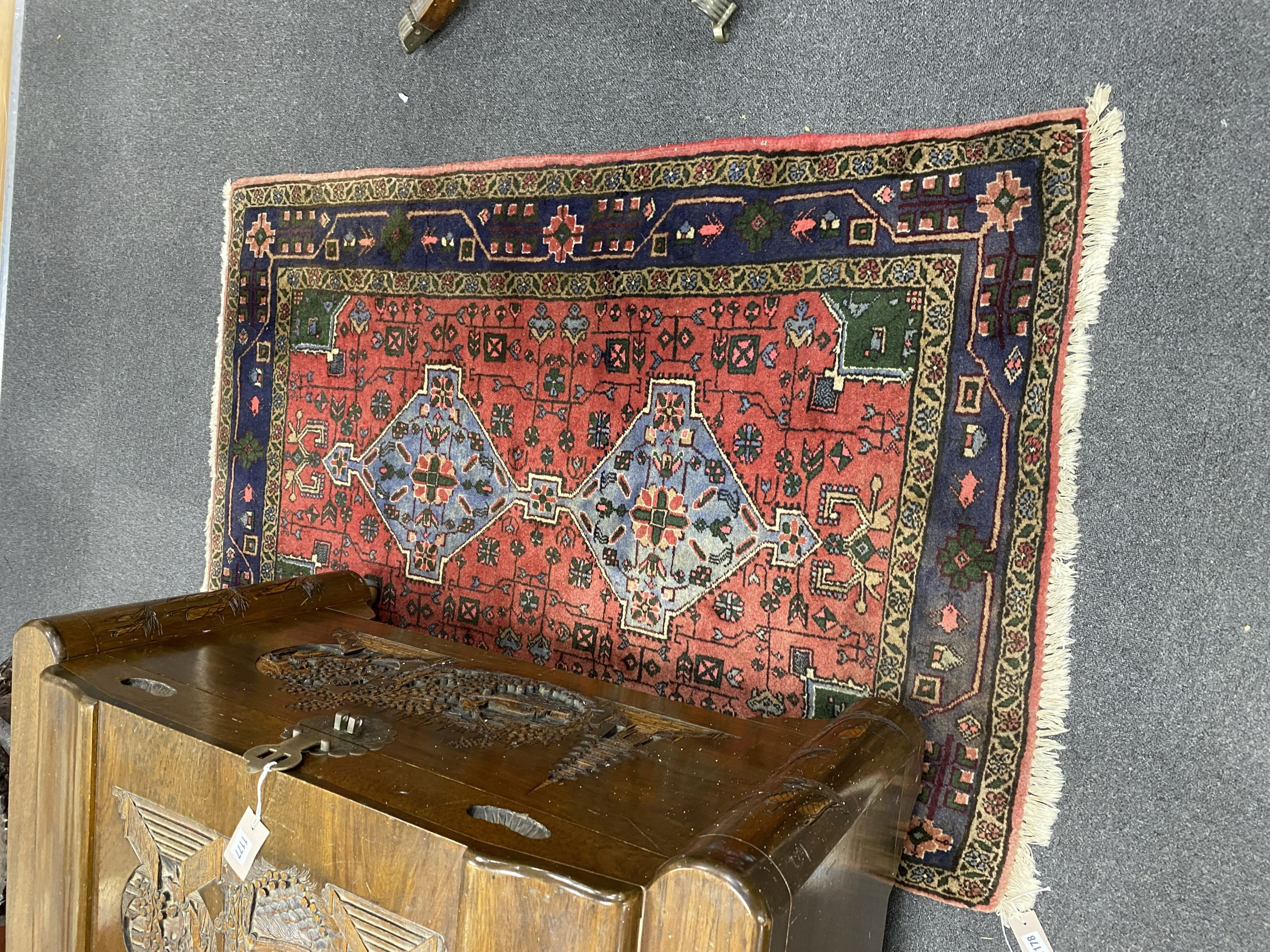 A Caucasian style red ground rug, 150 x 100cm